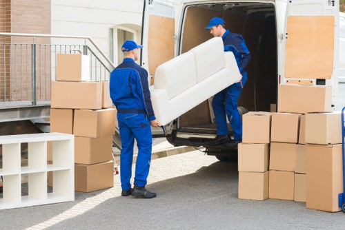 Local man with van moving furniture in Bayswater residential street