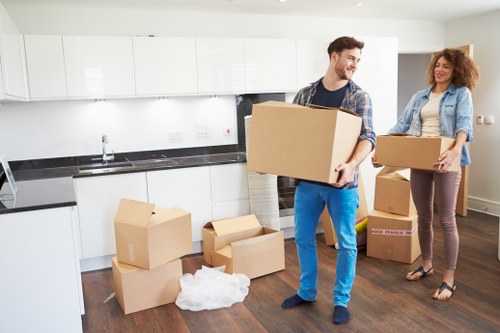 Packed moving boxes and furniture ready for transport in Bayswater