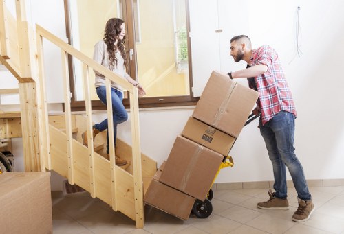 Movers handling desks and equipment during a Bayswater office relocation