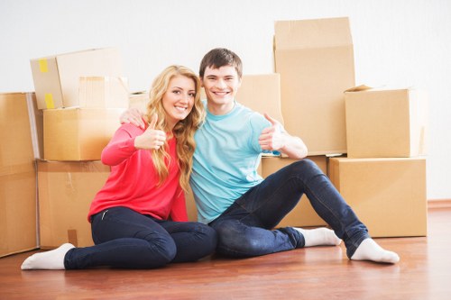 Contract and moving service paperwork beside packed boxes