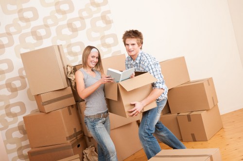 Moving team handling furniture during a scheduled removal service