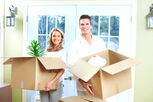 Careful loading of sofas and large household furniture into a removal truck